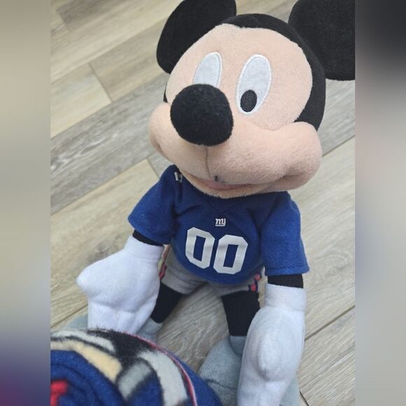 Giants blanket with Disney's Mickey plush hugging it - Picture 9 of 12